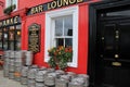 Inviting scene of colorful kegs and flowers in window boxes outside Bill Hawke Beer garden,Adare,Ireland,2014