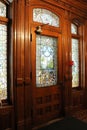 Bright sunlight streaming through stained glass windows of historic 1890 House Museum, Cortland, New York, 2018