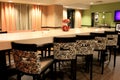 Inviting scene of long tables and chairs in ultra-modern design in dining area, Holiday Inn, Waterloo, New York,2015