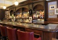 Beautiful seating at long wood bar with well-stocked cabinets, Morrissey`s, The Adelphi Hotel, Saratoga Springs, New York, 2018