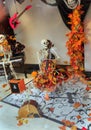 Inviting theatrical view, Halloween decoration with funny skeleton sitting and playing cello at down town Toronto music store