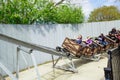 Inviting view of happy kids, children and adults enjoying their leisure time by riding on a mine carts