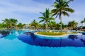 Inviting view of luxury swimming pool and hotel grounds in tropical garden