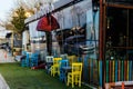 Vintage Restaurant Window With Colorful Shutters And Umbrella