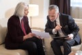 Involved businesswoman discussing the project with her colleague Royalty Free Stock Photo