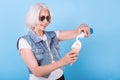 Involved senior woman adding cream in icecream.