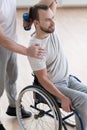 Involved young disabled man exercising in the gym