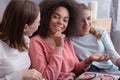 Involved young girls share opinions at home Royalty Free Stock Photo