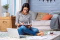 Involved young lady making notes in the bedroom