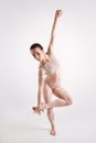 Involved young woman doing yoga in the studio