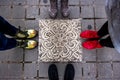 Four pair of shoes and typical floor tile