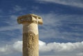 Ionic column against beatiful blue sky background Royalty Free Stock Photo