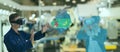 Iot industry 4.0 concept,industrial engineer using smart glasses with augmented mixed with virtual reality technology to monitorin