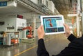 Iot industry 4.0 concept,industrial engineer using software augmented, virtual reality in tablet to monitoring machine in real t Royalty Free Stock Photo