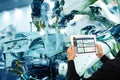 Iot industry 4.0 concept,industrial engineer using software augmented, virtual reality in tablet to monitoring machine in real t Royalty Free Stock Photo