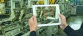 Iot industry 4.0 concept, Smart factory industrial engineer using tablet with augmented mixed with virtual reality technology to m Royalty Free Stock Photo