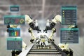 Iot industry 4.0 concept.Smart factory using automation robotic arms with augmented mixed virtual reality technology to show data