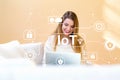 IoT security theme with young woman using her laptop Royalty Free Stock Photo