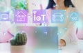 IoT theme with woman using her laptop Royalty Free Stock Photo