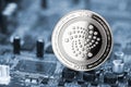 Iota crypto currency silver coin mining computer background Royalty Free Stock Photo