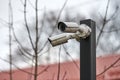 IP CCTV security camera on pole, urban cityscape Royalty Free Stock Photo