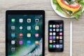 IPad Pro and iPhone with home screen in the table Royalty Free Stock Photo
