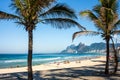 Ipanema Beach and front street with palms and mosaic of sidewalk