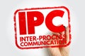 IPC INTER PROCESS COMMUNICATION displayed in a bold stamp style with a hand writing behind it, symbolizing technical interaction Royalty Free Stock Photo