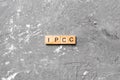 IPCC word written on wood block. abbreviation Intergovernmental Panel on Climate Change text on cement table for your desing, Royalty Free Stock Photo