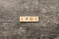 IPCC word written on wood block. abbreviation Intergovernmental Panel on Climate Change text on cement table for your Royalty Free Stock Photo