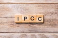 IPCC word written on wood block. abbreviation Intergovernmental Panel on Climate Change text on wooden table for your desing, Royalty Free Stock Photo