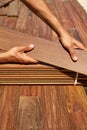 Ipe deck installation carpenter hands holding wood Royalty Free Stock Photo