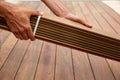 Ipe deck installation carpenter hands holding wood