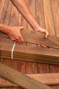 Ipe deck installation carpenter hands holding wood Royalty Free Stock Photo