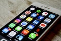 iPhone with assortment of apps displayed Royalty Free Stock Photo
