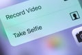 IPhone displaying the Camera icon app and context menu buttons