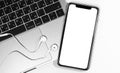 IPhone mockup and Macbook with Apple Earpods closeup at the white background