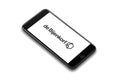 IPhone 8 plus smart phone lies on a flat colored surface. de Bijenkorf corporated logo onscreen, app, online schopping,