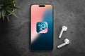 iPhone 15 Pro screen with new iOS 18 logo, the next operating system for Apple\'s smartphones wil