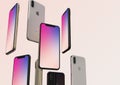 IPhone XS Gold, Silver and Space Grey smartphones, floating in air, colorful screen