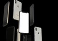 IPhone XS Gold, Silver and Space Grey smartphones, floating in air, white screen Royalty Free Stock Photo