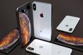 iPhone XS Silver smartphones, arranged in mosaic composition