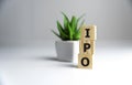 IPO - acronym from wooden blocks with letters, Initial Public Offering IPO concept, random letters around, white background Royalty Free Stock Photo