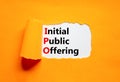 IPO initial public offering symbol. Concept words IPO initial public offering on beautiful white paper. Beautiful orange paper