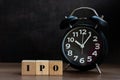 IPO word on wood cube block with clock Royalty Free Stock Photo