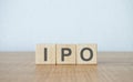 ipo word on wooden block on wooden table Royalty Free Stock Photo