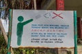 IPOH, MALAYASIA - MARCH 25, 2018: Sign in sevelar languages at the hill above Perak Tong cave temple in Ipoh, Malaysia Royalty Free Stock Photo