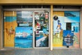 Exterior facade of a travel agency with Incredible India posters advertising tours to India