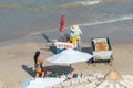 Man selling grilled cheese and drinks on a food cart at Porto de Galinhas beach