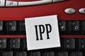 IPP - abbreviation on a white sheet against the background of a computer keyboard Royalty Free Stock Photo